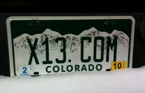 Two more .com license plates