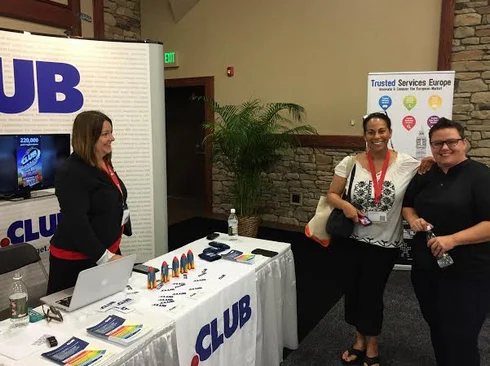 Two Petersons from Neustar visit the .Club booth at WorldHostingDays.