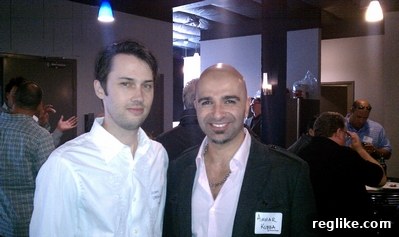 dt-4-kubba Adam Strong of Domain Name News (DNN) and industry veteran Ammar Kubba engaging in a lively conversation at the DomainTools open house, amidst the celebratory atmosphere.