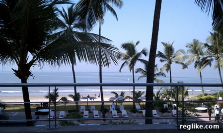 juhu-beach Stunning sunset view of Juhu Beach and the Arabian Sea from a high-rise hotel in Mumbai, reflecting the city's blend of natural beauty and urban development.