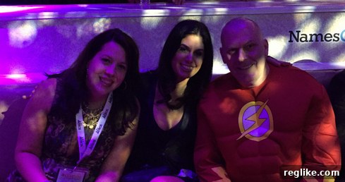 Amanda Waltz and Tracy Fogarty admiring Alan Dunn's shaved head, a charitable act for The Water School at NamesCon.