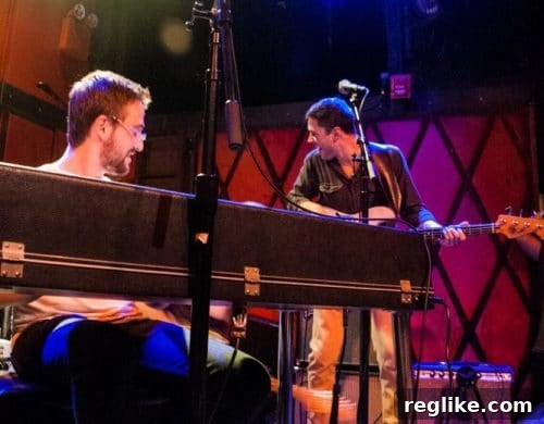 Vulfpeck Musician's Controversial Domain Takeover Attempt 2 Vulfpeck performing live on stage in NYC, demonstrating their unique funk style to an enthusiastic crowd.