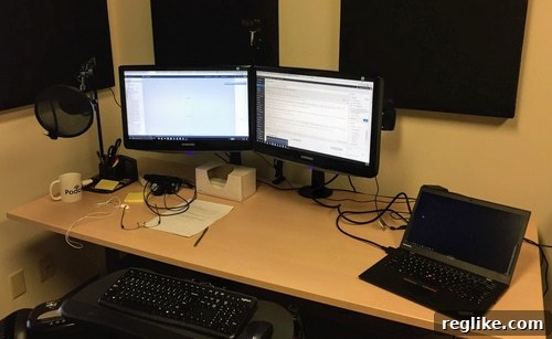 My 30-Day Digital Nomad Experiment 3 A well-organized home office setup with dual monitors, keyboard, and mouse.