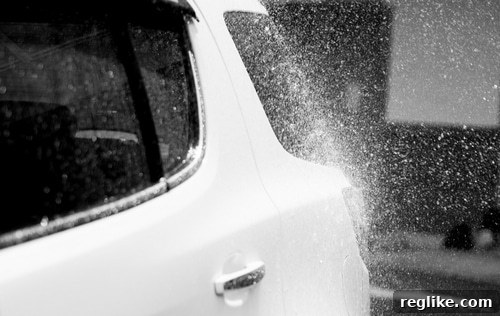 Overspray Firm Faces Backlash in Cybersquatting Case 2 Photo of a car with overspray paint, illustrating overspray removal services