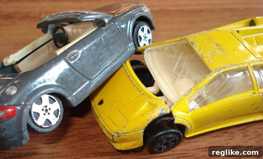 Chrysler Ditches Its Online Branding 2 Toy cars in a crash symbolizing brand domain strategy shifts.