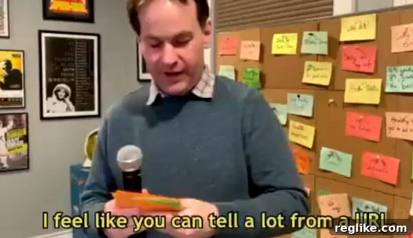 Mike Birbiglia's Hilarious Domain Name Musings 2 Comedian Mike Birbiglia delivering a humorous online monologue about the nuanced differences and inherent perceptions associated with various top-level domain names, highlighting the cultural significance of choosing the right website address.