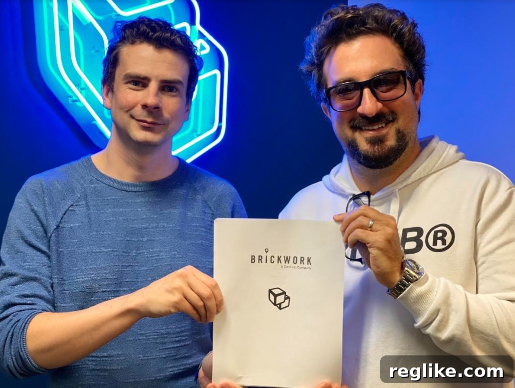 DevHub Fuels Local Retail Tech Growth with Brickwork Software Acquisition 2 Picture of DevHub CTO Daniel Rust and CEO Mark Michael holding a purchase agreement for Brickwork Software