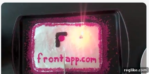 Company Powers Up With Front.com And Celebrates Big 2 A picture of a cake that says frontapp.com