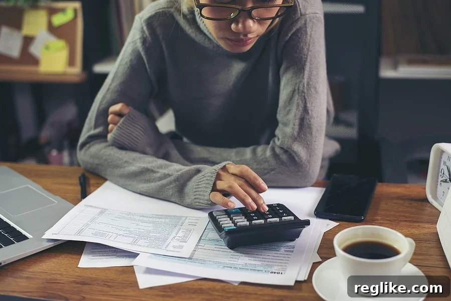 Woman calculating taxes, illustrating domain investing tax season preparation
