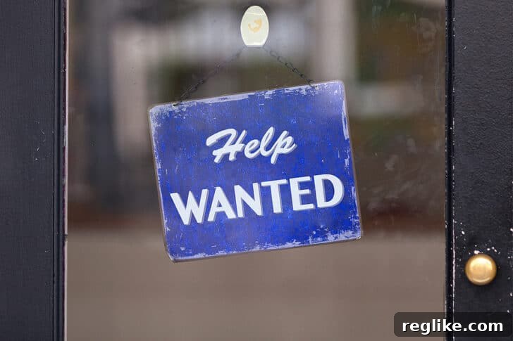 Squadhelp Fuels Growth with $10M Raise, Expanding Team 2 A help wanted sign on a window symbolizing new career opportunities in the digital domain industry