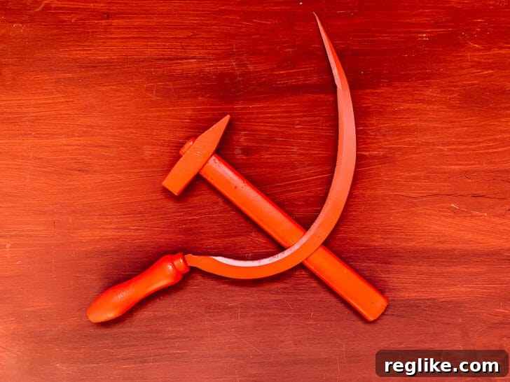 Unraveling Dot Com Communism 2 Hammer and sickle communism graphic – A visual representation of a politically charged symbol.