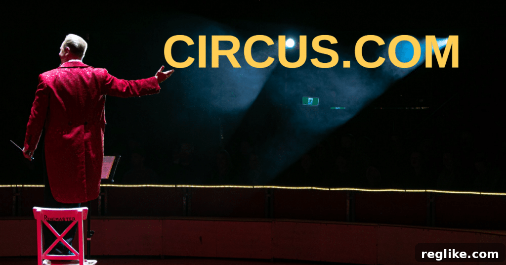 Picture of a circus ringmaster in a red coat standing on a chair, with a hand outstretched and the word circus.com in yellow letters