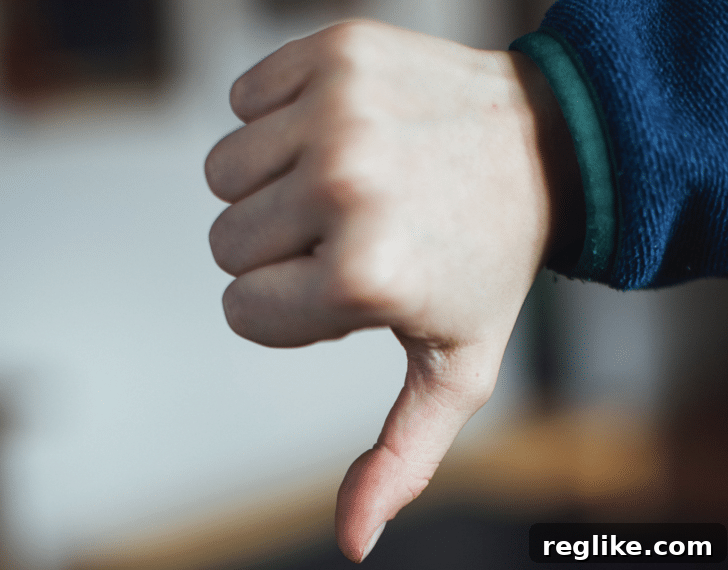 Legal Misstep: Firm Strikes Out in Domain Disputes 2 Person giving a thumbs down, symbolizing disapproval or failure in legal proceedings.
