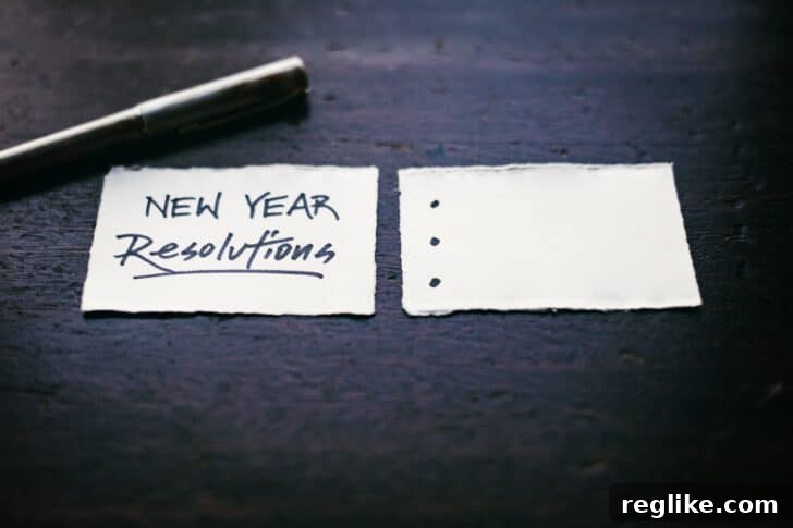Two scraps of paper. The left one has "New Year Resolutions" written, and the right one has three bullet points that are blank.