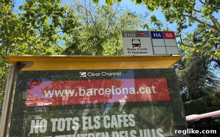 Spain: Sights and Sites 5 Barcelona.cat on the side of a bus stop